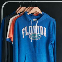 We took the classic, arched “Florida” from their 1986-87 basketball uniforms and combined it with one of the most well-known logos in sports. The scowling gator head wasn’t in official use until 1994, but soon after, Florida’s hoops fortunes would skyrocket. Products are mocked up on a size S. Graphics may appear smaller on larger sizes. Basketball Hoodie, Basketball Uniforms, Florida Gators, Royal Blue, Basketball, Shop Now, Florida, Sports, Sweatshirts