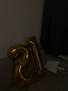 the number twenty two balloons are on the couch