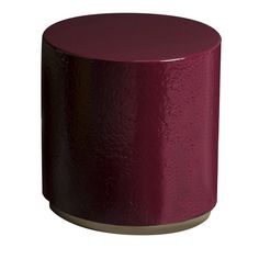 a small purple stool sitting on top of a white floor