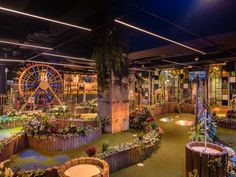 an indoor miniature golf course with lots of plants