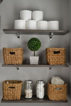 the shelves are organized with baskets and toilet paper