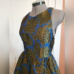 Fun Color In This Flirty Olive And Blue Quilted T Back Brocade Mini Dress By Ark & Co. Fabric Has Gorgeous Sheen And Weight Which Gives The Circle Mini Skirt Volume. T Top With Zip Back And Interesting Side And Back Cutouts. Bust 34. Waist 25. Hip Free. Nwt. Size Small. Blue Fit And Flare Midi Dress For Evening, Blue Fit And Flare Dress For Night Out, Fitted Midi Dress For Summer Festive Occasions, Fitted Festive Midi Dress For Summer, Royal Blue Sleeveless Midi Dress For Party, Fitted Midi Dress For Summer Festivals, Fitted Midi Dress For Summer Festivities, Blue Festive Dress For Party Season, Evening Fit And Flare Blue Dress