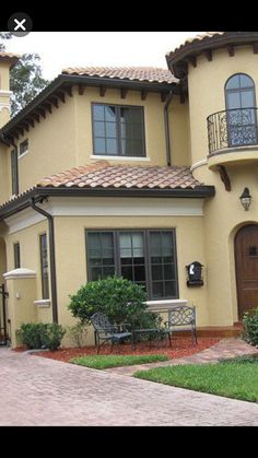 a house that is yellow and brown in color