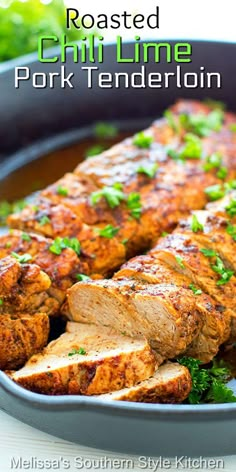 roasted chili lime pork tenderie in a skillet with parsley on the side