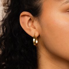 Introducing our stylish Thick Hoops, a fashion-forward accessory that adds a touch of boldness to your everyday style! Elevate your jewelry collection today with this chunky and modern pair of hoops that seamlessly complement any outfit. Material: High Quality Solid 925 Sterling Silver Finish: Sterling Silver ∙ 18K Gold Hoop Dimensions: ~22mm Inner Diameter | ~24mm Outer Diameter Featuring bold & chunky ~4mm Thick Hoop Earrings Sold as a Pair Part of our Hoop Earrings Collection Model showcases Chic Tarnish-resistant Hoop Earrings, Gold Tarnish-resistant Hoop Earrings, Modern Tarnish-resistant Hoop Earrings, Modern Chunky Small Hoop Earrings, Chunky Gold Hoop Earrings Minimalist, Baguette Studs, Initial Tag Necklace, Thick Hoop Earrings, Dainty Initial Necklace