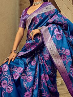 This beautiful ensemble features a beautiful blue-color silk saree with intricate threadwork and zari weaving, adding a touch of elegance and sophistication to your look. The saree comes with a purple silk blouse that also showcases exquisite zari weaving work, making it a perfect match for the saree.
The 5.50-meter saree and unstitched blouse material offer you the freedom to customize the fit according to your preference. The silk fabric ensures a comfortable drape, allowing you to move with e Wedding Blue Meenakari Blouse Piece, Semi-stitched Blue Meenakari Blouse Piece, Semi-stitched Blue Blouse Piece With Meenakari, Blue Katan Silk Blouse Piece, Transitional Blue Art Silk Blouse Piece, Blue Katan Silk Blouse Piece With Meenakari, Blue Meenakari Katan Silk Blouse Piece, Semi-stitched Royal Blue Saree, Royal Blue Art Silk Bollywood Saree