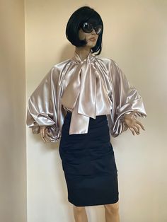 "Amazing and extravagant silk blouse with bow tie collar. Rich puffy sleeves. Elegant and extravagant, perfect for your special occasions. SIZE S - US 6, UK 8, EU 36 bust: bust around 34.5\"/90cm Waist: waist around 27.5\"/70cm Hips: hips around 34.5\"/90cm SIZE M - US 8, UK 10, EU 38 bust: bust around 37.5\"/95cm Waist: waist around 29.5\"/75cm Hips: hips around 37.5\"/95cm SIZE L - US 10, UK 12, EU 40 bust: bust around 39.5\"/100cm Waist: waist around 31.5\"/80cm Hips: hips around 39.5\"/100cm Luxury Satin Blouse, Elegant Silk Top With Balloon Sleeves, Luxury Silk Blouse With Tie Sleeves, Luxury Voluminous Balloon Sleeve Blouse, Luxury Silk Blouse With Bow Detail, Luxury Blouse, Puffy Sleeves Blouse, Satin Tops, Cream Silk Blouse