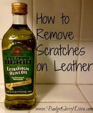 a bottle of extra virgin olive oil next to a tile wall with the words how to remove scratches on leather