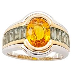 Yellow Sapphire 1.91 carats with Green Sapphire 1.43 carats Ring set in 18K Yellow/White Gold Settings Width: 2.0 cm Length: 1.3 cm Ring Size: 52 Total Weight: 9.61 grams "We first opened doors in 1980 when it was then situated in the vicinity of the Victory Monument; a small and modest storefront with a couple of counters. From its humble beginnings to where it stands today, our company has proven its abilities as a jeweler. Since the beginning, we have been supplying fine quality pieces to dea Luxury Faceted Yellow Gold Sapphire Ring, Tsavorite Ring, Green Sapphire Ring, Yellow Sapphire Rings, Pink Sapphire Ring, Diamond Ring Settings, Modern Ring, Green Sapphire, Sapphire Stone