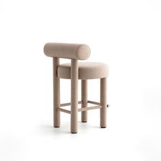 the stool is made out of wood and has a beige upholstered backrest