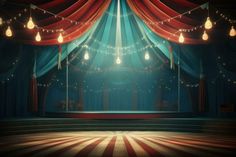 an empty stage with red and blue drapes on the curtained walls, lit by hanging lights