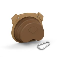 Make sure your pup stays hydrated and well fed wherever you go with this collapsible dog bowl! Shaped as an adorable brown puppy face, this travel dog bowl will brighten up your dog's assortment of supplies. Made of silicone, it collapses to a compact size and comes with a carabiner clip to easily attach to a leash, handbag or belt loop. This foldable dog bowl is convenient to bring along when you are walking your dog, traveling, hiking or taking a trip to the dog park, and is perfect for servin Collapsible Dog Bowl, Travel Dog Bowl, Animal Shaming, Dogs Stuff, Brown Puppies, Dog Cafe, Pet Hotel, Puppy Face, Sweet Dogs