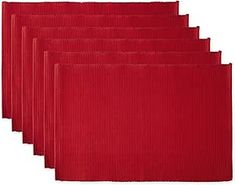 six red placemats on a white background