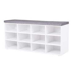 a white shelf with several cubbys and a gray top on it's sides