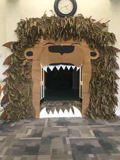 a large paper cut out of a lion with its mouth open and teeth wide open