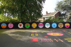 an empty parking lot with painted faces on it