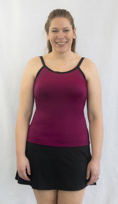 Complete Shaping® mastectomy tankini swim top and / or activewear all-inclusive with built-in lightweight breast prostheses, so no need to purchase additional breast forms. No mastectomy bra band or heavy elastics across chest, just smooth fabric against mastectomy scars. No visible seams across the front. Entire garment with built-in prosthetics weighs between 8 and 12 ounces, depending on size. Full coverage with the ease of a two-piece swimsuit and adjustable straps for perfect placement. Nylon Swimwear With Built-in Bra For Training, Fitted Workout Tankini With Built-in Bra, Sporty Fitted Tankini With Upf 50+, Sports Tankini With Built-in Bra And Stretch, Stretch Tankini With Upf 50+ For Workout, Athleisure Swimwear With Medium Bust Support, Fitted Tops With Adjustable Straps For Pilates, Fitted Sports Tops With Built-in Cups, Fitted Workout Tops With Upf 50+