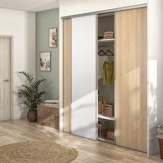 an empty room with a large mirror and some baskets on the floor in front of it