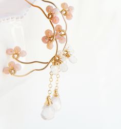 "Cherry blossoms (Sakura) inspired pale pink opal chandelier earrings. Japanese celebrate when blooming Sakura, the tree brings happiness and joy. A very unusual, pretty earrings,sure to get you noticed. 🔸14k gold filled or Sterling silver 20gaude (0.8mm thick), pink opal, rose quartz, rainbow moonstone 🔸Rose quartz briolette 5.5mm x 8mm Total length of the earrings is 2.1\" (5.4cm ) Come with 14k gold filled ear back Come in gift box 🔸Silver version, https://www.etsy.com/listing/500312720/pi Elegant Spring Chandelier Earrings, Spring Gift Chandelier Dangle Earrings, Spring Gift Chandelier Drop Earrings, Spring Gift Drop Chandelier Earrings, Pink Hoop Earrings For Wedding With Ear Wire, Pink Chandelier Earrings, Cherry Blossom Earrings, Sakura Japanese, Pink Chandelier