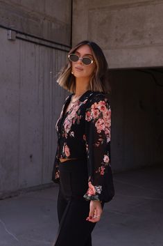 Effortlessly elevate your everyday look with our Flawless Florals Top. Featuring a beautiful floral print, button down design, and comfortable long sleeves, this top is perfect for any occasion. Add a touch of elegance to your wardrobe with this must-have piece. Fabric 100% polyester Floral Spring Tops For Night Out, Floral Print Long Sleeve Top For Night Out, Long Sleeve Floral Print Tops For Night Out, Chic Floral Print Tops For Night Out, Spring Floral Print Tops For Date Night, Chic Floral Print Button-up Blouse, Trendy Floral Print Blouse For Night Out, Floral Print Tops For Date Night In Spring, Fall Date Night Top With Floral Print