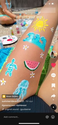 someone has their arm painted with watermelon and other things to paint on it