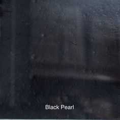 a window with rain drops on it and the words black pearl written in white letters