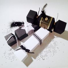 several black and white boxes with feathers on them