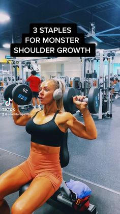 a woman sitting on top of a bench with dumbbells in front of her