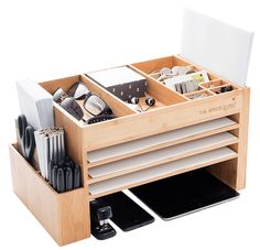 a wooden desk organizer filled with office supplies