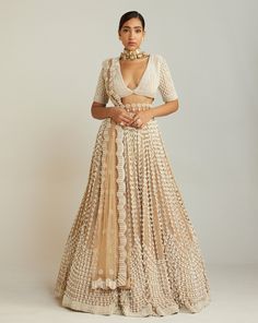 Beige chandelier pearl lehenga paired with heavy pearl embellished V-neck blouse with elbow sleeve.From Vvani Vats Jhoomar collection.DELIVERY TIMEPlease allow 8-12 weeks for your outfit to arrive.FABRIC DETAILSBlouse - Georgette, Lehenga - Georgette, Dupatta - Net, Lining - Silk BlendProfessional cleaning only. DISCLAIMERBelts are additionally chargeable. Pearl Work Lehenga, Beige Chandelier, Pearl Lehenga, Vani Vats, Full Sleeve Blouse, Pearl Work, Work Lehenga, Georgette Dupatta, Beige Blouse