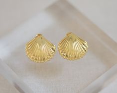 Crafted from 14k gold vermeil, these Sanibel Earrings feature shell studs that are both elegant and lightweight. Designed for comfortable wear and a subtle yet stunning look. Elegant Shell-shaped Gold Plated Earrings, Elegant Gold-plated Shell-shaped Earrings, Elegant Gold Shell Earrings, Yellow Gold Shell-shaped Earrings, Elegant Shell-shaped Yellow Gold Earrings, Yellow Gold Shell-shaped Earrings For Pierced Ears, Elegant Yellow Gold Shell Earrings, Shell-shaped Yellow Gold Earrings Gift, Shell-shaped Yellow Gold Earrings For Gifts