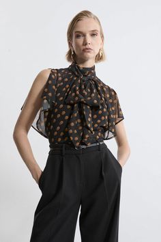 Elevate Your Top Selection With Our Blouse, Which Boasts A Relaxed Fit, And A Statement Bow And Ruffle Design, Ideal For Enriching Your Occasion Wear Selection. The High Neckline Elevates The Formality, While The Polka Dot Print Brings A Playful Feeling. This Piece Pairs Well With Anything, From A Fitted Midi Skirt, To Tailored Trousers, To Jeans For An Elevated Look That Will Take You Seamlessly From Day To Night. Georgette Spot Pussy Bow Tie Woven Blouse High Quality Georgette Fabric Playful P Petite Work Outfits, Petite Wedding Guest Dresses, Jumpsuit For Wedding Guest, Fitted Midi Skirt, Plus Size Workwear, Summer Bridesmaid Dresses, Statement Blouse, Ruffle Design, Italy Outfits