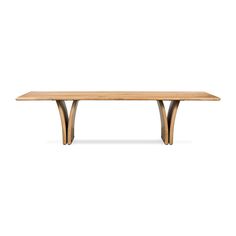 a wooden table sitting on top of a white floor