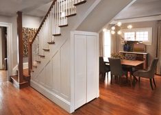 an open floor plan with stairs leading up to the dining room