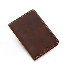 Start an international adventure with our new Priam Handmade Leather Passport Cover. The cover is made using full-grain crazy horse leather. This distressed leather is beautiful and will develop an amazing patina over time. The Priam Handmade Leather Passport Cover is a great way to protect your passport. It has been designed with the help of our professional designers in order to provide you with an elegant yet practical solution for your travel documents. The design features two compartments t Modern Leather Wallet For Daily Use, Modern Leather Wallets For Daily Use, Leather Bags With Card Slots For Travel, Modern Leather Backpack For Daily Use, Leather Wallets For Everyday Use, Minimalist Leather Wallet For Everyday Carry, Versatile Brown Leather Wallets, Minimalist Rectangular Leather Backpack, Classic Bags With Card Slots For Everyday