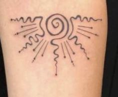 a tattoo on the leg of a woman with sun and rays coming out of it