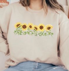 Sunflower Crewneck Sweatshirt, Sunflower lover shirt, Gift for Gardener, Gardening Shirt, Spring flowers, Kindness Shirt, Sunflowers Plants Sizes: S-5X Unisex Fit Size up for an oversized sweatshirt fit DTG Print Machine wash inside out and fry on low heat.  T Shirts and Tank Tops Available  Made with a unisex heavy blend crewneck sweatshirt is pure comfort. These sweaters are made from polyester and cotton. This combination helps designs come out looking fresh and beautiful. The collar is ribbe Sweatshirt Collar Outfit, Long Sleeve Sunflower Print Tops For Spring, Spring Long Sleeve Top With Sunflower Print, Spring Crew Neck Shirt With Sunflower Print, Yellow Long Sleeve Tops With Sunflower Print, Spring Long Sleeve Sunflower Print Top, Yellow Long Sleeve Top With Sunflower Print, Sunflower Clothes, Cheap Sunflower Design Crew Neck T-shirt