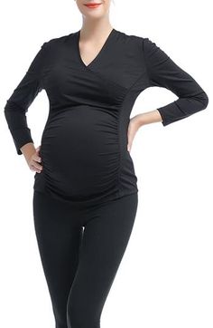 Stretchy, lightweight fabric will keep you comfortable throughout every stage of pregnancy while staying active in this long-sleeve top. Gathered sides flatter your growing baby bump and a surplice V-neck will make nursing discreet and easy once your little one arrives. 25" length Surplice V-neck Long sleeves 88% nylon, 12% spandex Machine wash, tumble dry Imported Stretch Long Sleeve Maternity Tops, Fitted Long Sleeve Maternity Tops, Long Sleeve Fall Maternity Tops, Black Stretch Maternity Top, Black Stretch Tops Bump Friendly, Fitted Maternity Tops, Fitted Nursing Friendly Tops For Maternity, Fitted Maternity Tops For Nursing, Fitted Nursing-friendly Maternity Tops