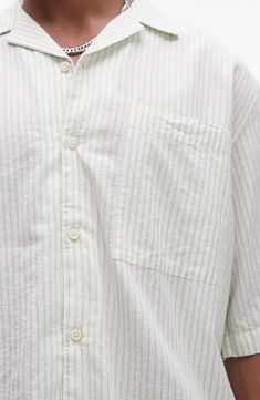 Roomy and relaxed, this camp shirt cut from lightweight cotton sports pale pinstripes and a casual, wear-everywhere vibe. 29" length; 46" chest (size Medium) Front button closure Notched collar Elbow-length sleeves Chest patch pocket 100% cotton Machine wash, line dry Imported Striped Cotton Camp Shirt For Spring, White Unstructured Casual Camp Shirt, Casual Striped Camp Shirt With Camp Collar, Striped Short Sleeve Shirt With Camp Collar For Spring, Spring Striped Short Sleeve Shirt With Camp Collar, Spring Striped Short Sleeve Shirt With Relaxed Fit, Casual Striped Camp Shirt For Spring, Pinstripe Shirt With Relaxed Fit And Short Sleeves, Pinstripe Short Sleeve Relaxed Fit Shirt