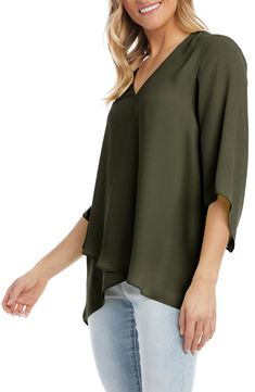 An elegant top of silky, lightweight crepe delivers elegant movement with its angled flare sleeves and fluttery asymmetrical hemline that dips low in back. 25 1/2" length (size Medium) V-neck Three-quarter sleeves Back yoke with gathering Crossover high/low hem 100% polyester Dry clean or hand wash, line dry Made in the USA of imported fabric Women's Clothing Elegant Asymmetrical Blouse With Draped Sleeves, Elegant Blouse With Draped Asymmetrical Sleeves, Sleek Asymmetrical Tops For Spring, Chic Viscose Top With Asymmetrical Hem, Chic Viscose Tops With Asymmetrical Hem, Versatile Asymmetrical Evening Blouse, Chic Asymmetrical Drapey Tops, Elegant Asymmetrical Solid Blouse, Spring Formal Top With Asymmetrical Hem