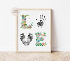 an art print with the letter e and two hand prints in floral designs on it