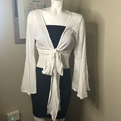 All The Summer Feels! Can Be Tied In Front Or Wrapped Multiple Times And Tied! Use As A Blouse Or Coverup! Boho Feels With Front Tie And Bell Sleeves. White Size Small Note: Sale Is Only For The Top. 1 Item. White Shirt Bell Sleeves, Chic Beach Tops With Drawstring Tie, Spring Crop Top With Tie Waist, Summer Tops With Tied Detail For Day Out, Spring Vacation Tops With Tie Waist, Summer Vacation Crop Top With Tie Waist, Tied Tops For Spring Vacation, Casual Vacation Tops With Tied Detail, White Tie Waist Top For Day Out