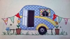 a blue and yellow camper is decorated with flowers, flags and buntings