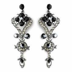 Black Crystal Chandelier Earrings These dramatic silver plated crystal earrings are beautifully designed with a vintage inspired brocade design. Both clear and black crystals give lots of sparkle! Perfect for your wedding day, prom or any special occasion in need of a glamorous touch. Size: Earrings are about 3" long and 1" wide. color: Silver/ Black. Style: 1031b. Perfect for the bride, her bridesmaids or for your quinceanera or prom! Need more than one pair for your bridesmaids or damas? You c Black Onyx Crystal, Wedding Earrings Chandelier, Clear Crystal Earrings, Emerald Green Earrings, Onyx Crystal, Crystal Chandelier Earrings, Emerald Earrings Studs, Prom Earrings, Bridesmaid Accessories