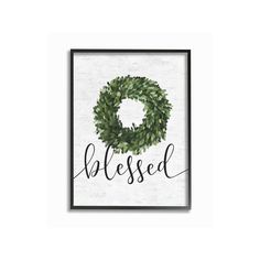 a framed sign with the word,'be blessed'in black and green leaves