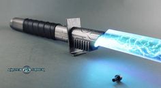 a blue light saber with lightning coming out of it's end and some ear plugs on the side