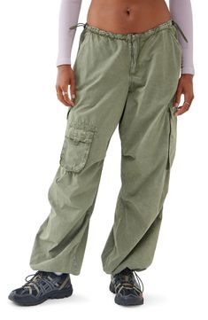 Bungee cords at the waist and cuffs let you adjust the fit of roomy cotton cargo joggers equipped with a mix of utility pockets. Exclusive retailer 30 1/2" inseam; 20" leg opening; 9 1/2" front rise; 15 1/2" back rise (size Medium) 100% cotton Machine wash, line dry Made in Turkey Green Utility Cargo Jeans With Relaxed Fit, Urban Baggy Joggers With Cargo Pockets, Urban Outfitters Spring Cargo Pants With Pockets, Urban Outfitters Wide Leg Cotton Cargo Pants, Urban Outfitters Spring Cargo Bottoms, Tech Cargo Pants, Flare Pants Boho, Utility Wide-leg Cargo Pants With Drawstring, Red Joggers