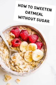 a bowl filled with oatmeal topped with raspberries and banana slices