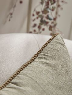 a close up of a pillow on a bed