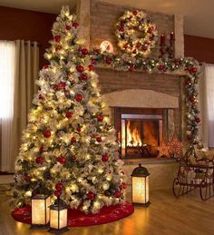 a decorated christmas tree sitting in front of a fireplace